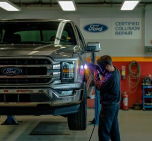 Auto-body-tech-working-on-a-Ford-Truck-certified-collision-repair-at-Terrys-Auto-Body-and-Paint